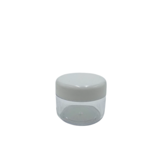 Petit pot cosmétique en plastique cristal de 30ml avec un couvercle blanc, idéal pour stocker des crèmes, gels ou baumes en format voyage ou échantillon.